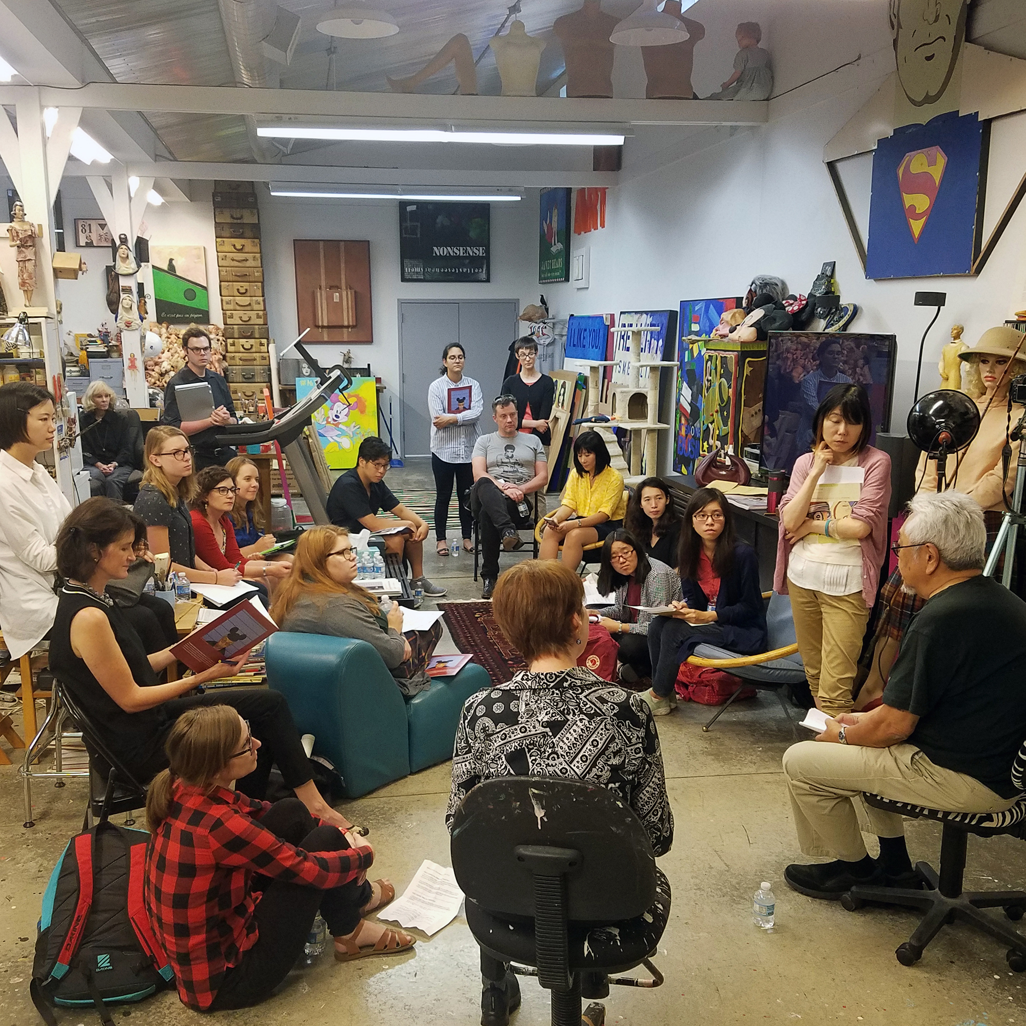 Students in artist Roger Shimomura's studio